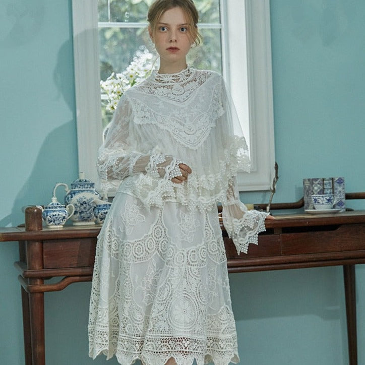 Indulge in sophistication with our Robe Britta. The perfect blend of vintage and modern, this elegant robe features intricate lace patchwork and delicate embroidery. Designed for the most discerning women, it's a unique addition to any wardrobe. Perfect for spring and fall, this is a must-have for any Victorian-inspired look.