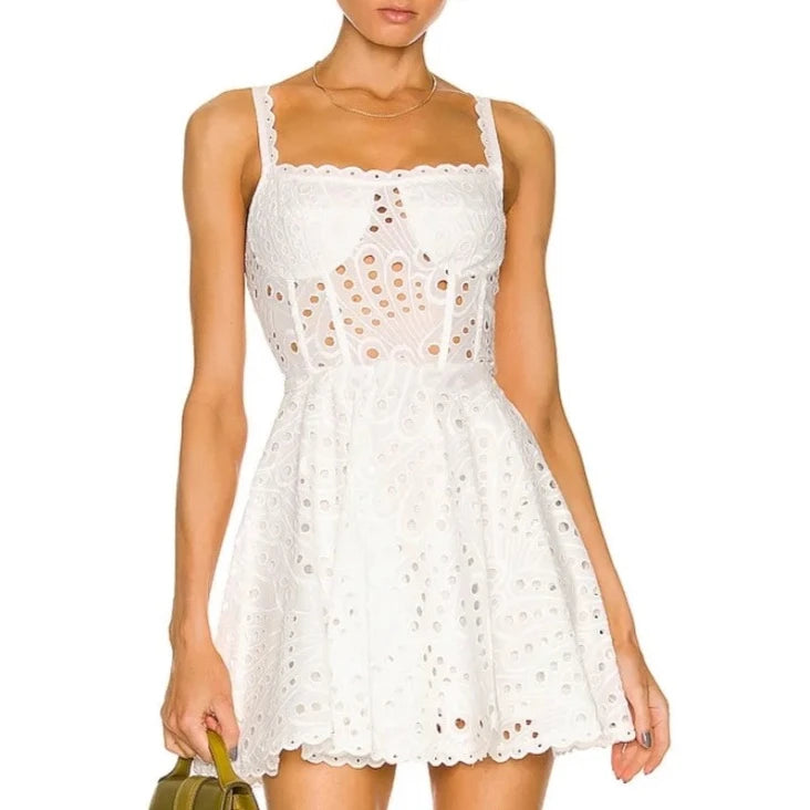 Looking for the perfect summer dress? Look no further than Dress Ricka! This sexy sleeveless dress features beautiful embroidery and a delicate lace design, making it perfect for any occasion. The high waist and hollow out details add a touch of elegance to this mini dress. Stay cool and stylish this summer with Dress Ricka.