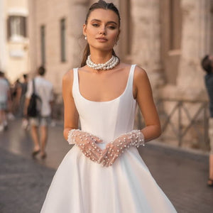 Indulge in the luxurious and exclusive Robe Lola. Crafted with a satin fabric, this gown features a chic A-line design fit for any princess bride. Elevate your bridal experience with this sophisticated and elegant piece.