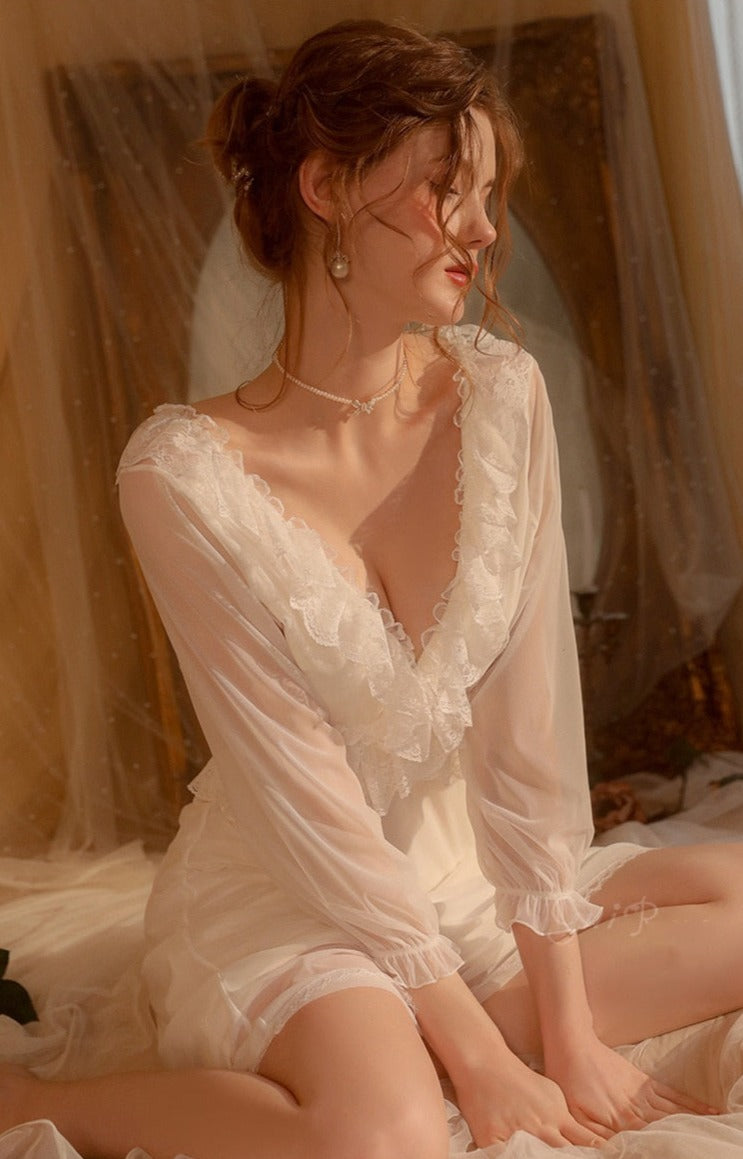 Introducing the Robe du Soir Jeannie, a French-inspired nightgown that exudes elegance and vintage charm. Slip into this luxurious piece and indulge in a taste of luxury, reminiscent of a bygone era. Let the intricate details and French style transport you to a world of sophistication and refinement. Truly a must-have for any discerning individual.