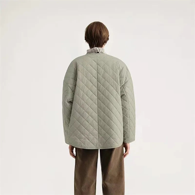 Experience the ultimate comfort and style with Totême Women's Natural Organic Cotton Quilted Jacket. Embrace the Nordic minority spring cotton coat, featuring a classic diamond lattice design and a loose profile for a chic and relaxed look. Made with pure, high-quality cotton, this matte jacket is perfect for any season.