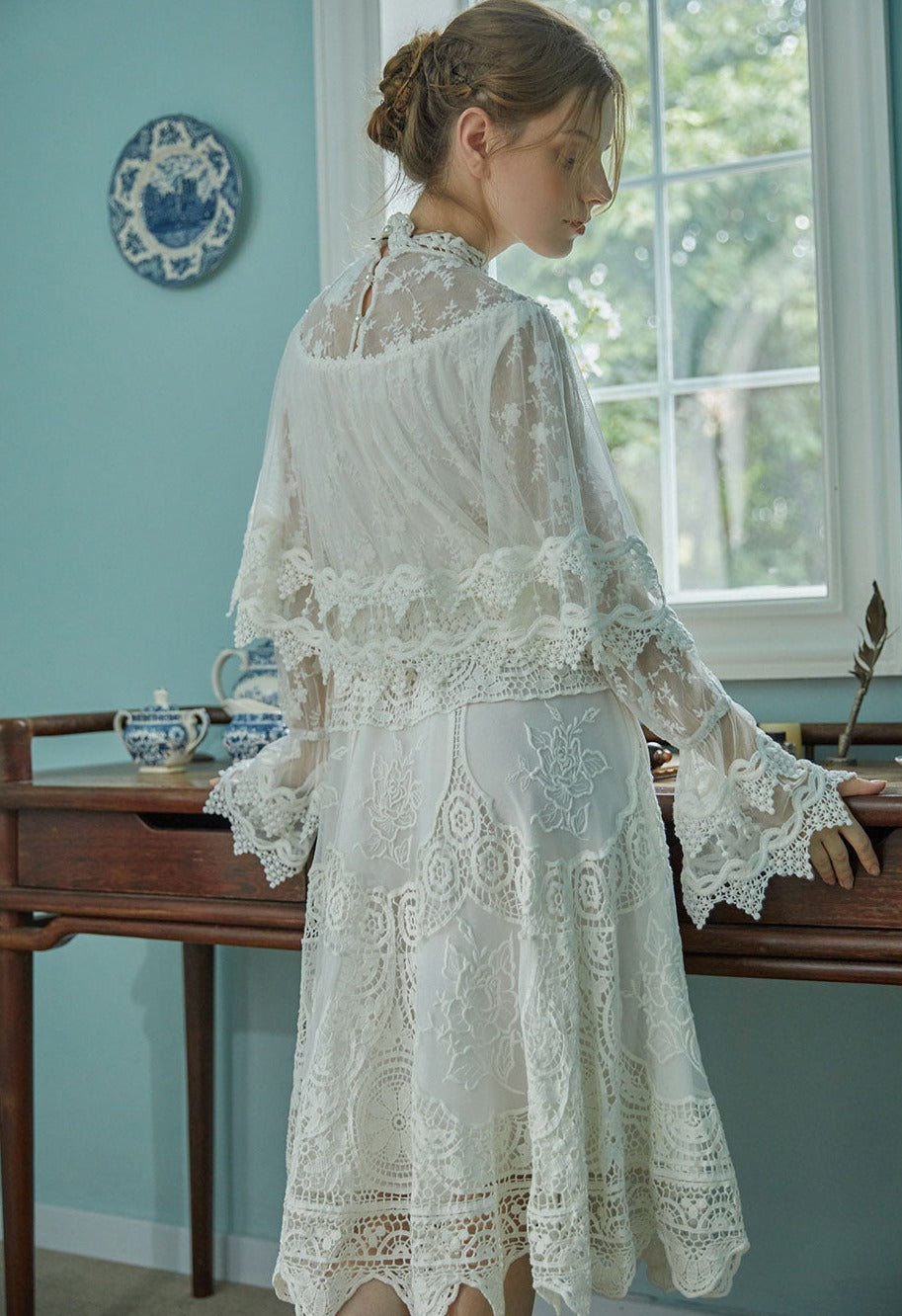 Indulge in sophistication with our Robe Britta. The perfect blend of vintage and modern, this elegant robe features intricate lace patchwork and delicate embroidery. Designed for the most discerning women, it's a unique addition to any wardrobe. Perfect for spring and fall, this is a must-have for any Victorian-inspired look.