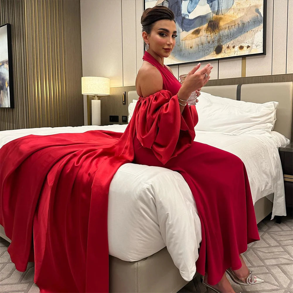 Indulge in glamour with our Robe Leilane. This stunning satin prom dress boasts a halter neck and off the shoulder design, exuding sophistication and confidence. Make a statement at any event with this luxurious piece.