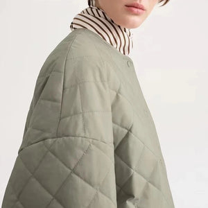 Experience the ultimate comfort and style with Totême Women's Natural Organic Cotton Quilted Jacket. Embrace the Nordic minority spring cotton coat, featuring a classic diamond lattice design and a loose profile for a chic and relaxed look. Made with pure, high-quality cotton, this matte jacket is perfect for any season.