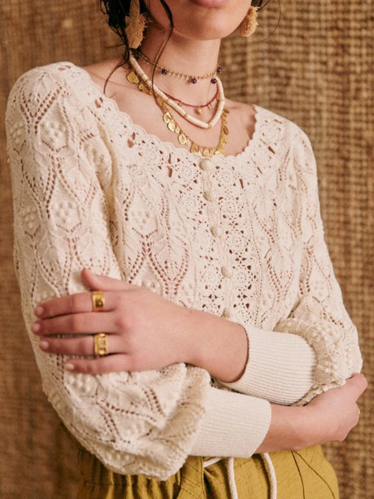 Elevate your look with Cardigan Anika. Crafted from 100% cotton, this brand women's sweater boasts a delicate hollow out crochet design, perfect for spring and summer. With a large O neck and solid color, this knitted cardigan exudes elegance and refinement. A must-have for any fashion-forward wardrobe.