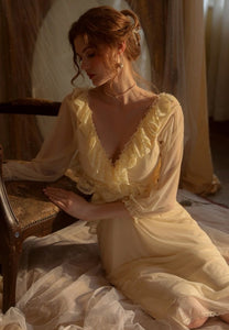 Introducing the Robe du Soir Jeannie, a French-inspired nightgown that exudes elegance and vintage charm. Slip into this luxurious piece and indulge in a taste of luxury, reminiscent of a bygone era. Let the intricate details and French style transport you to a world of sophistication and refinement. Truly a must-have for any discerning individual.