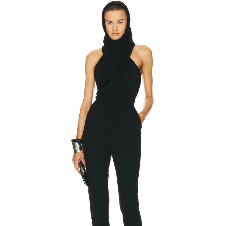 The Combinaison Isadore is a sleek and elegant jumpsuit for women. Featuring a sexy sleeveless design and a backless hooded collar, this jumpsuit is perfect for making a statement. The full length cut adds a touch of sophistication while the hooded design adds a hint of edge. Elevate your style with the Combinaison Isadore.