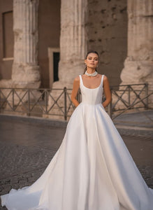 Indulge in the luxurious and exclusive Robe Lola. Crafted with a satin fabric, this gown features a chic A-line design fit for any princess bride. Elevate your bridal experience with this sophisticated and elegant piece.