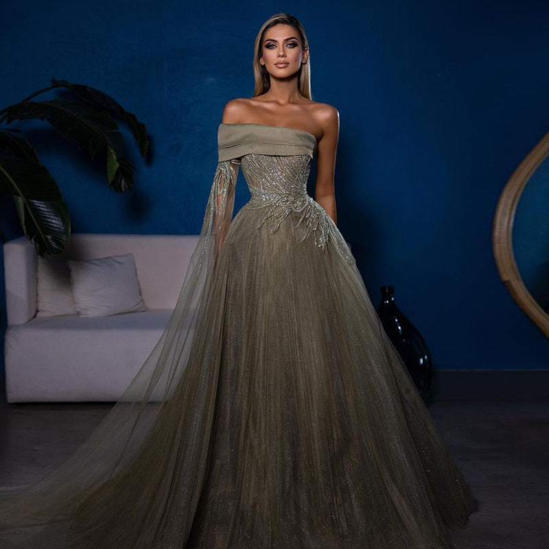 "Channel your inner princess with our Robe Rafaela! This ball gown dress will make you feel like royalty with its regal design and flattering silhouette. Say goodbye to ordinary dresses and hello to your fairytale moment!"