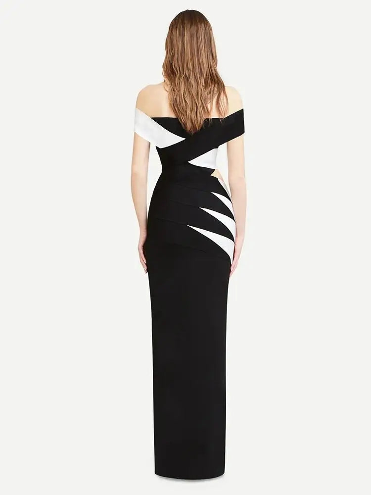 The Dress Zaina  by Zuhair Murad is a stunning piece that combines sexy black and white colors with an elegant spliced design. Featuring an off-shoulder style and a tight, form-fitting silhouette, this dress also has a hollow midsection for a touch of allure. Perfect for any formal event or special occasion, this long bandage dress is a must-have for any fashion-forward individual.