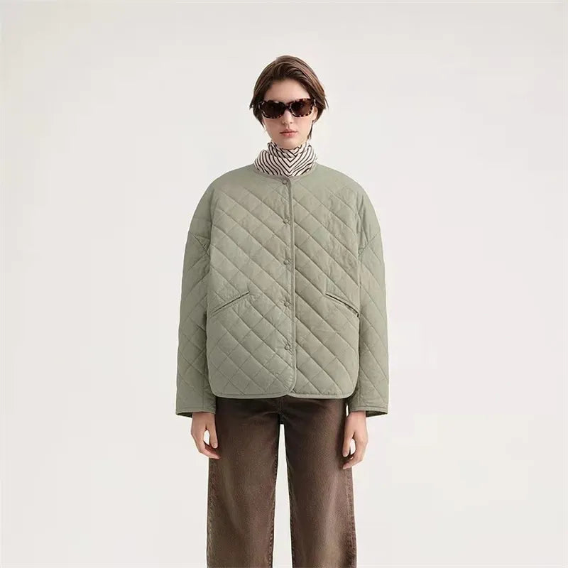 Experience the ultimate comfort and style with Totême Women's Natural Organic Cotton Quilted Jacket. Embrace the Nordic minority spring cotton coat, featuring a classic diamond lattice design and a loose profile for a chic and relaxed look. Made with pure, high-quality cotton, this matte jacket is perfect for any season.