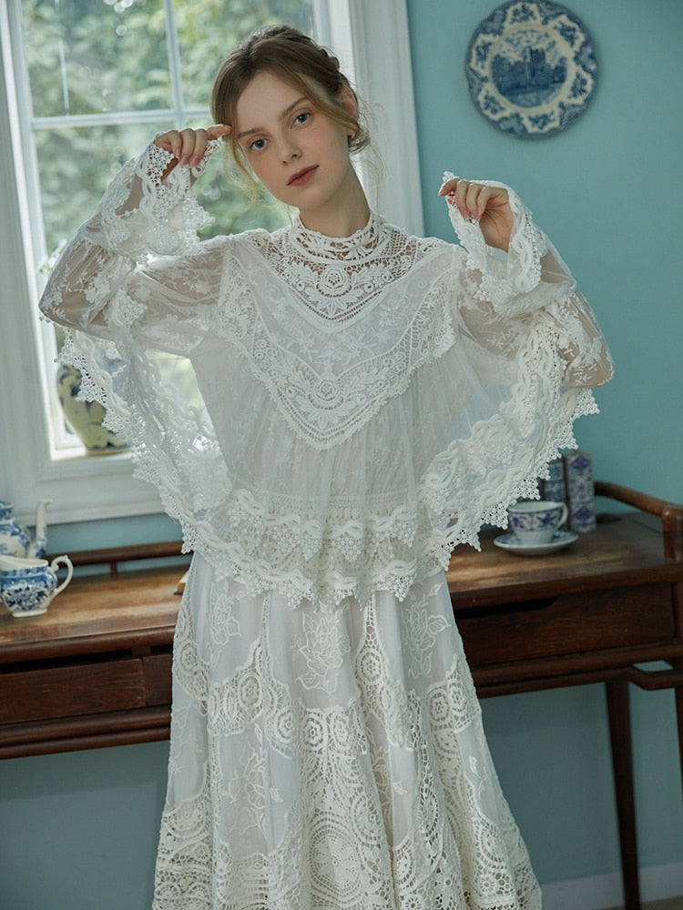 Indulge in sophistication with our Robe Britta. The perfect blend of vintage and modern, this elegant robe features intricate lace patchwork and delicate embroidery. Designed for the most discerning women, it's a unique addition to any wardrobe. Perfect for spring and fall, this is a must-have for any Victorian-inspired look.