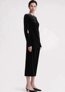 This black velvet Twisted Velvet Dress is designed by TOTEME with a playful asymmetric silhouette and concealed zippers for a body-hugging fit. Add a pair of mules for an effortless evening look.