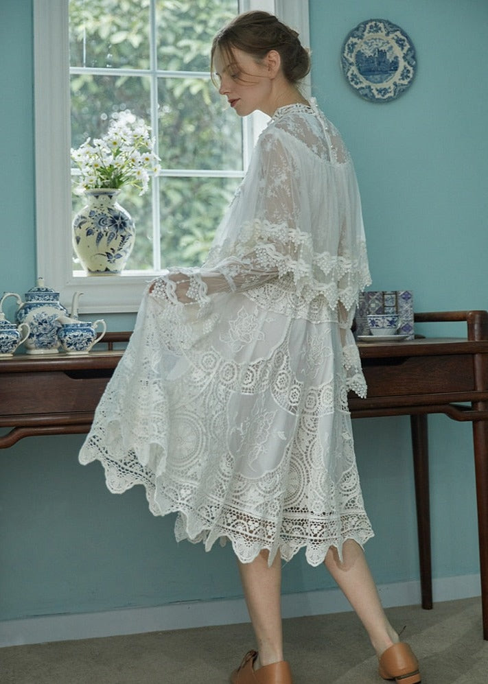 Indulge in sophistication with our Robe Britta. The perfect blend of vintage and modern, this elegant robe features intricate lace patchwork and delicate embroidery. Designed for the most discerning women, it's a unique addition to any wardrobe. Perfect for spring and fall, this is a must-have for any Victorian-inspired look.