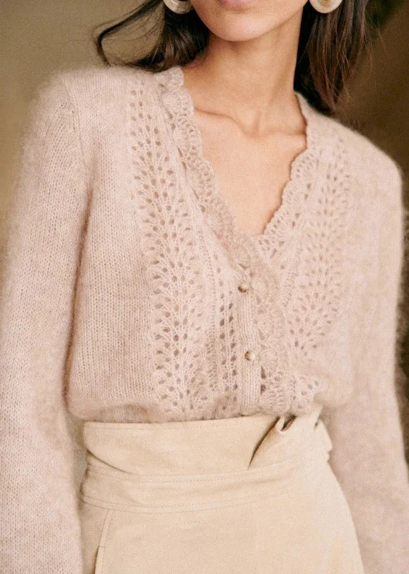 Introducing the Cardigan Angelie, a delicate wool blend cardigan perfect for spring and summer. Designed with gentle crochet knitted details, this cardigan offers both style and comfort. Stay fashionable and cool with this must-have addition to your wardrobe.