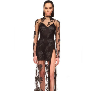 This Rose Macrame Slit Gown in Black is an elegantly designed dress that features long sleeves, a sexy lace design, and a split mesh detail. Designed to enhance your natural curves, this dress is perfect for any formal occasion. Its intricate macrame details and feminine silhouette will make you stand out in a crowd.