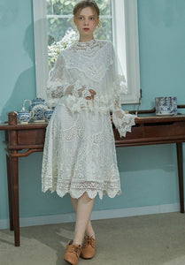 Indulge in sophistication with our Robe Britta. The perfect blend of vintage and modern, this elegant robe features intricate lace patchwork and delicate embroidery. Designed for the most discerning women, it's a unique addition to any wardrobe. Perfect for spring and fall, this is a must-have for any Victorian-inspired look.