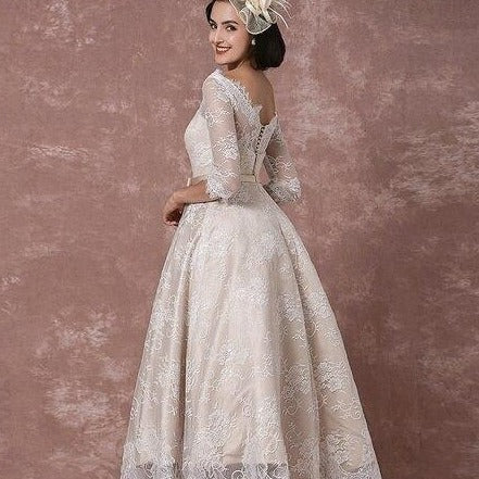 Introducing the Robe Mayze - the perfect vintage lace wedding gown for your special day. Hand-crafted with intricate details, this gown exudes elegance and charm. Dazzle your guests and feel confident as you walk down the aisle.