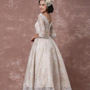 Introducing the Robe Mayze - the perfect vintage lace wedding gown for your special day. Hand-crafted with intricate details, this gown exudes elegance and charm. Dazzle your guests and feel confident as you walk down the aisle.