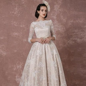 Introducing the Robe Mayze - the perfect vintage lace wedding gown for your special day. Hand-crafted with intricate details, this gown exudes elegance and charm. Dazzle your guests and feel confident as you walk down the aisle.