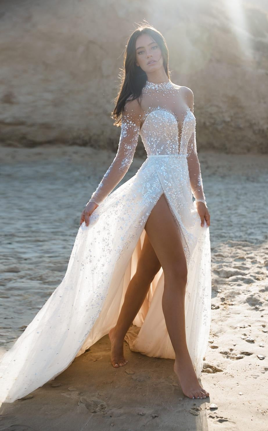 Experience the epitome of elegance with our Robe Rosinne. This stunning bridal beach gown exudes luxurious sophistication, making you feel like a true goddess on your special day. With its beautiful design and high-quality materials, this robe is sure to make you the center of attention as you walk down the aisle or stroll along the beach. Elevate your wedding experience with the Robe Rosinne.