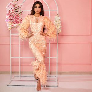 Discover your inner beauty with Robe Frankie. Our custom-made, long-sleeved evening dress offers sparkle and shimmer with its beaded siren design and crystals. Make a statement while you dance the night away in a gown that fits you perfectly and reaches the floor. Live life with style and confidence!