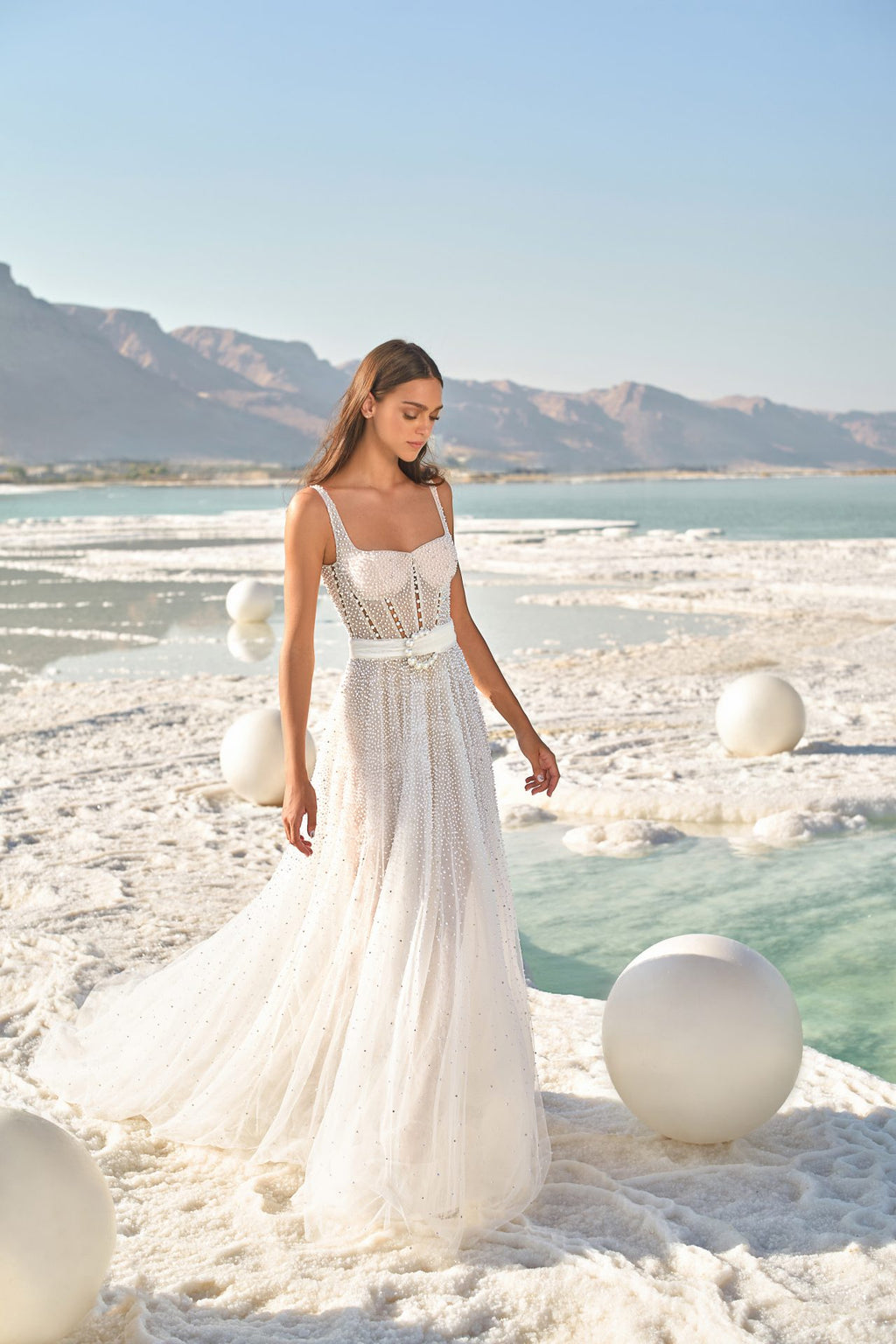 Indulge in pure elegance with our Robe Chantelle. This enchanting gown, delicately embroidered with dreamy white lace, is the perfect choice for your special day. With its ethereal design, this stunning robe will make you feel like the bride of your dreams. Elevate your bridal style with Robe Chantelle.