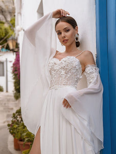 Indulge in luxury with our Robe Maggie, a chic bridal gown that will make you feel like a work of art on your special day. Embrace the sophisticated and exclusive style of this gown, with intricate details and a flattering silhouette. Elevate your wedding experience with Robe Maggie.