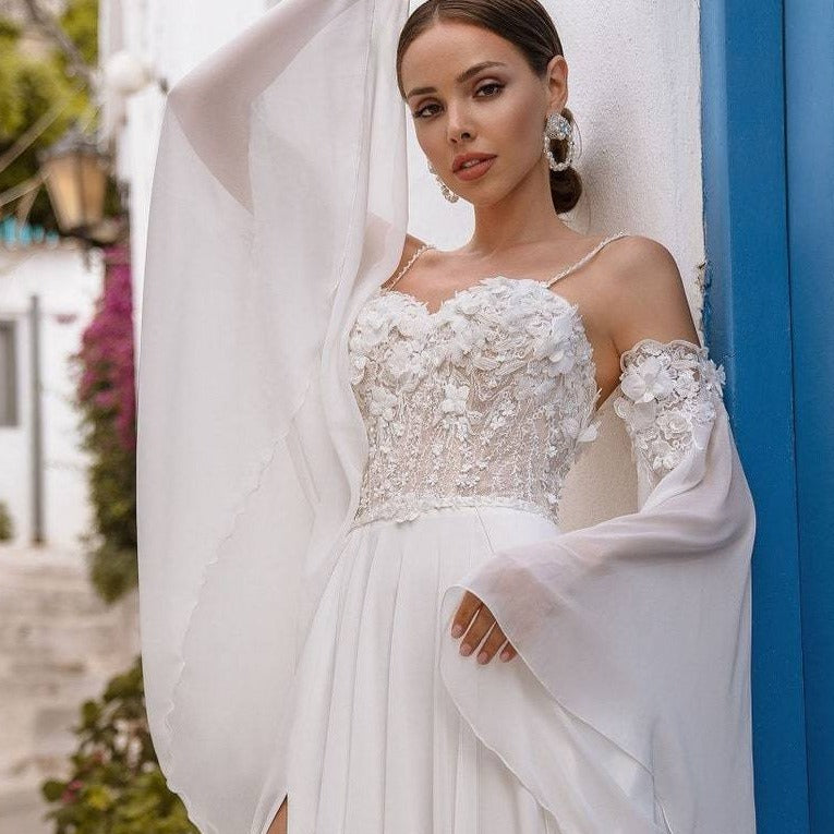 Indulge in luxury with our Robe Maggie, a chic bridal gown that will make you feel like a work of art on your special day. Embrace the sophisticated and exclusive style of this gown, with intricate details and a flattering silhouette. Elevate your wedding experience with Robe Maggie.