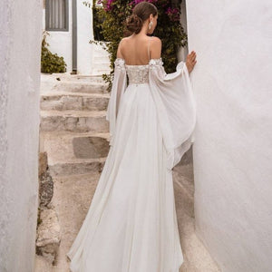 Indulge in luxury with our Robe Maggie, a chic bridal gown that will make you feel like a work of art on your special day. Embrace the sophisticated and exclusive style of this gown, with intricate details and a flattering silhouette. Elevate your wedding experience with Robe Maggie.