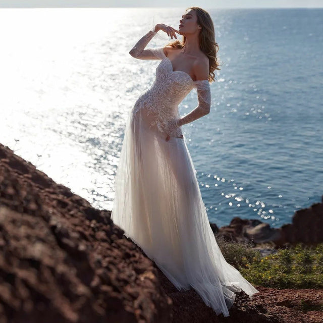 Be the belle of the ball in the elegant white lace bridal gown, Robe Dionysus. This exquisite robe will make you feel like a goddess on your special day. Embrace its delicate lace and intricate details for a timeless and stunning wedding look.